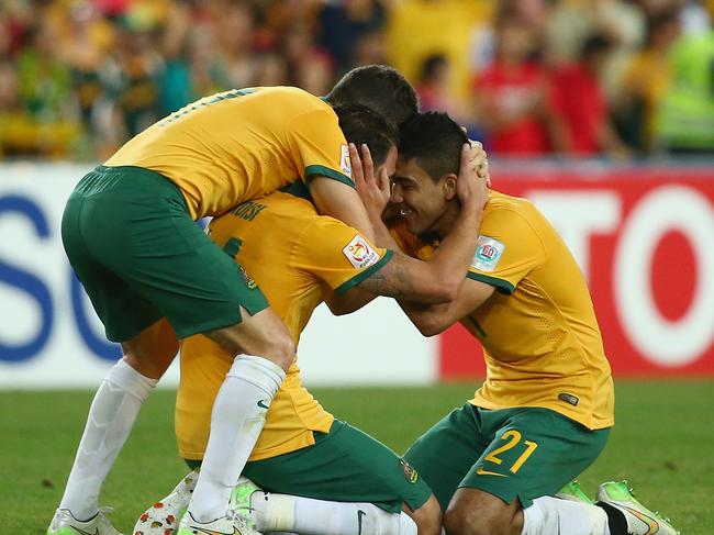 SYDNEY, AUSTRALIA - JANUARY 31: Matt McKay, James Troisi and Massimo Luongo of Australia celebrate victory during the 2015 Asian Cup final match between Korea Republic and the Australian Socceroos at ANZ Stadium on January 31, 2015 in Sydney, Australia. (Photo by Mark Kolbe/Getty Images)