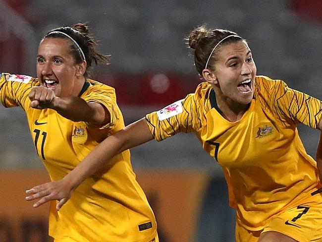 AMMAN, JORDAN - APRIL 17:  Players of Australia celebrate winning the AFC Women's Asian Cup semi final between Australia and Thailand after a penalty shoot out at the King Abdullah II Stadium on April 17, 2018 in Amman, Jordan.  (Photo by Francois Nel/Getty Images)