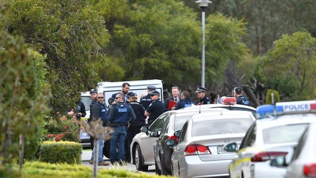 Police and detectives at the scene of a house shooting at West Lakes. Picture: AAP/Mark Brake