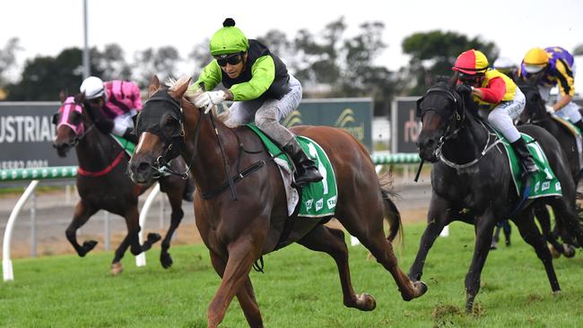 Jockey Jag Guthmann-Chester (centre) rides Cabeirian to victory in race four, the Lilydale Chicken Handicap during the QTIS Jewel Raceday at Aquis Park on the Gold Coast, Saturday, March 16, 2019, (AAP Image/Darren England) NO ARCHIVING, EDITORIAL USE ONLY