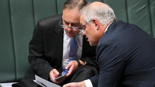 Scott Morrison and Health Minister Greg Hunt come to grips with the existential during question time on Tuesday. Picture: AAP