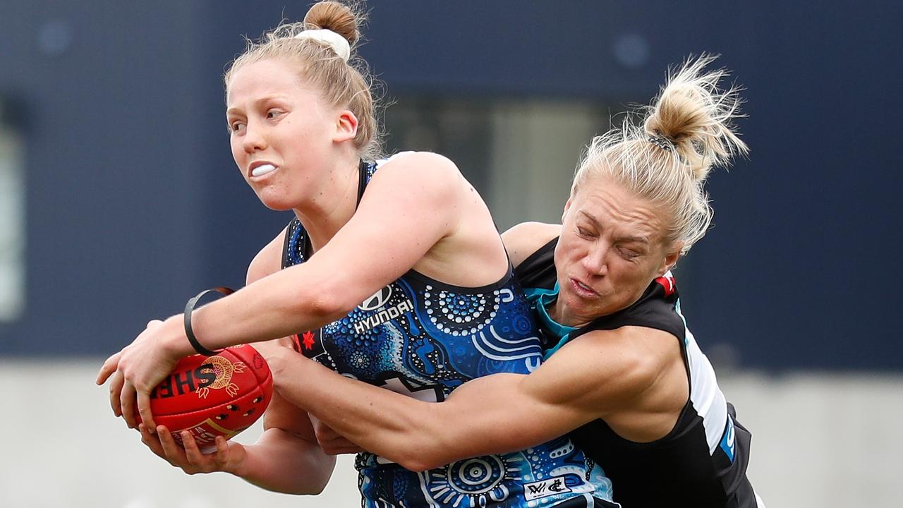 MELBOURNE, AUSTRALIA - SEPTEMBER 11: Paige Trudgeon of the Blues is tackled by Erin Phillips of the Power during the 2022 S7 AFLW Round 03 match between the Carlton Blues and the Port Adelaide Power at Ikon Park on September 11, 2022 in Melbourne, Australia. (Photo by Michael Willson/AFL Photos via Getty Images)