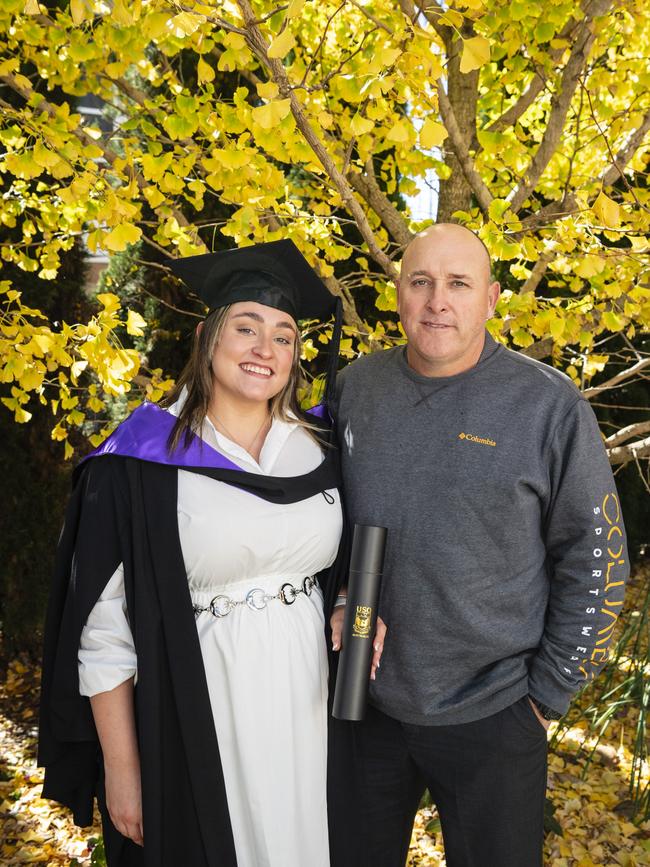 Associate Degree of Criminology and Criminal Justice graduate Delaney Holder with dad Michael Holder at a UniSQ graduation ceremony at Empire Theatres, Tuesday, June 27, 2023. Picture: Kevin Farmer