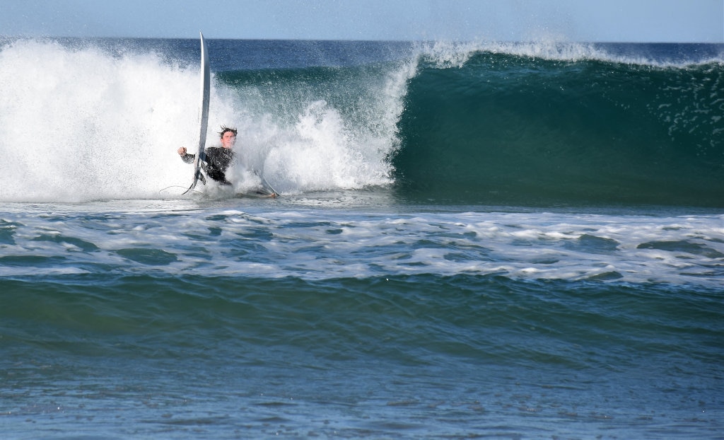 Surfers and bodyboard riders making the most of the waves at Kawana on the weekend. Picture: Mark Furler