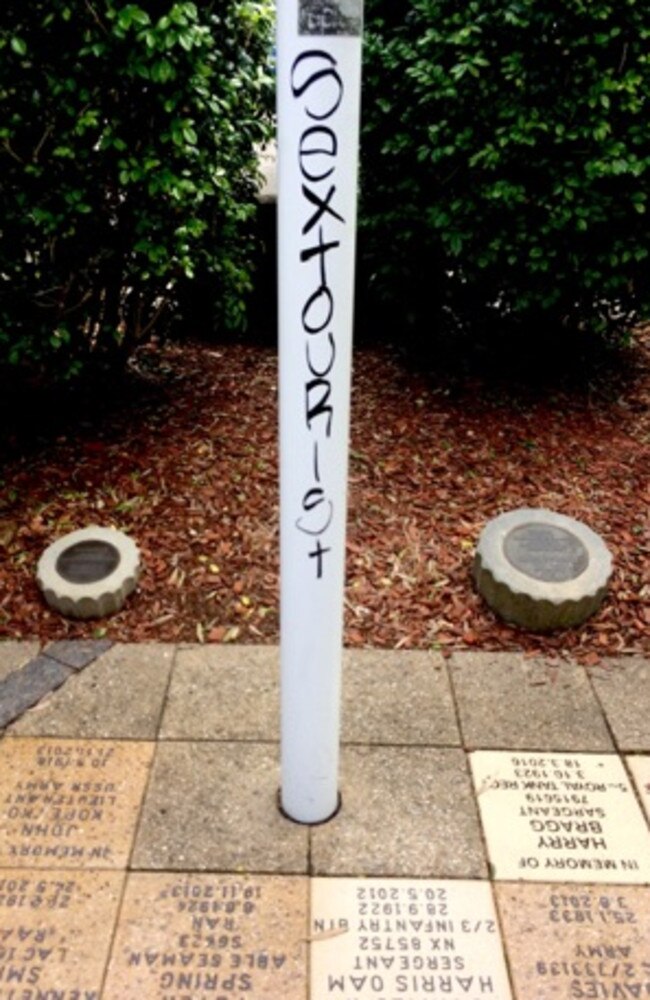 The words ‘sex tourist’ scribbled onto a war memorial flag pole. Picture: Tamara Sloper-Harding