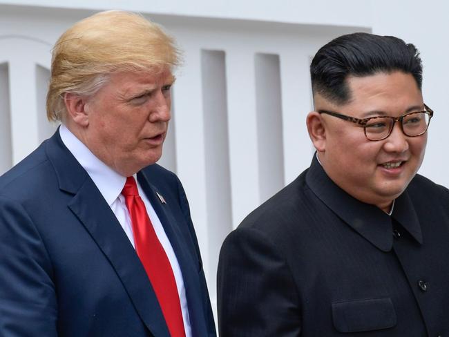 US President Donald Trump and North Korea leader Kim Jong Un walk from lunch at the Capella resort on Sentosa Island in Singapore on June 12, 2018.  Donald Trump and Kim Jong Un became on June 12, the first sitting US and North Korean leaders to meet, shake hands and negotiate to end a decades-old nuclear stand-off. / AFP PHOTO / POOL / Susan Walsh