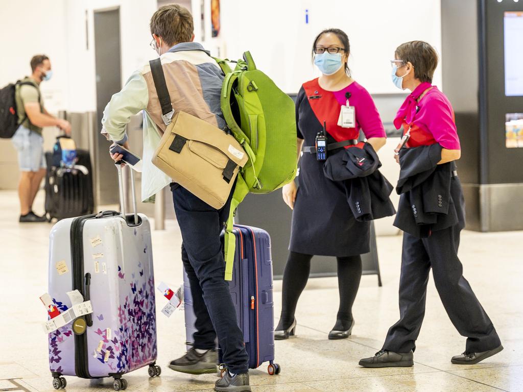 Qantas staff were directing arriving passengers to buses. Picture: Darren Leigh Roberts