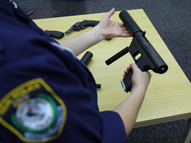 An officer displays another high-powered weapon.