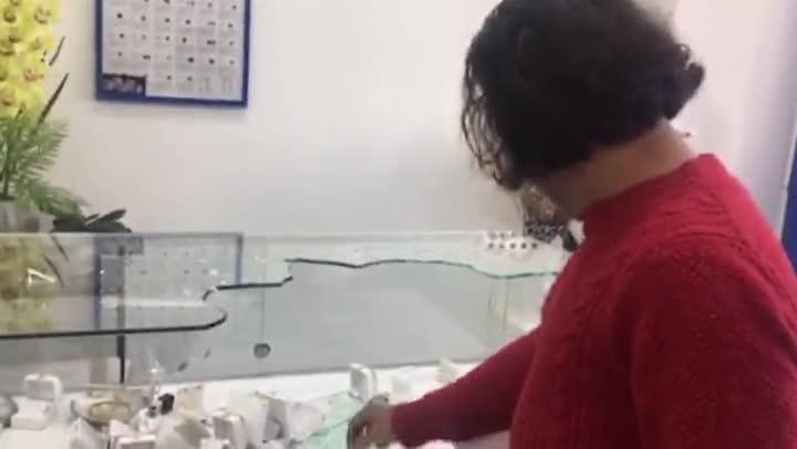 Mohammed Jafari looking as his remaining jewels after daylight robbery
