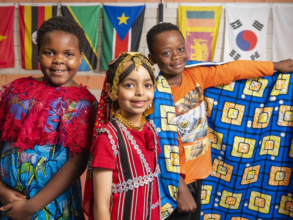 Representing their culture are (from left) Faith Bahati, Chum Ibrahim and Dieume Antoine at Harmony Day celebrations at Darling Heights State School. Picture: Kevin Farmer