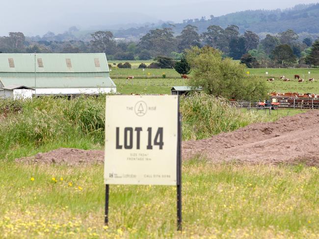 A lot in a housing estate is offered for sale with the farm in the background. Picture: Mark Stewart