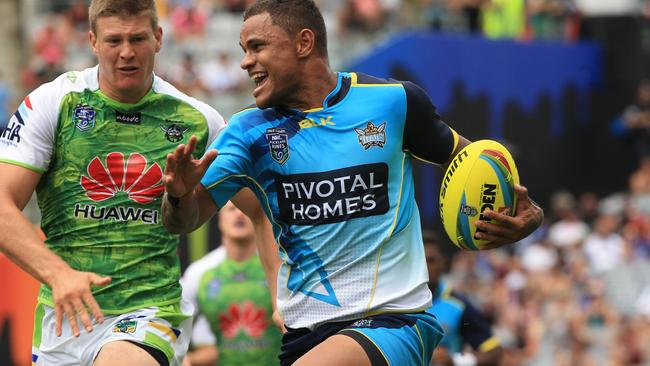 Josh Hoffman scores for the Titans in their game against Canberra during the 2015 event.