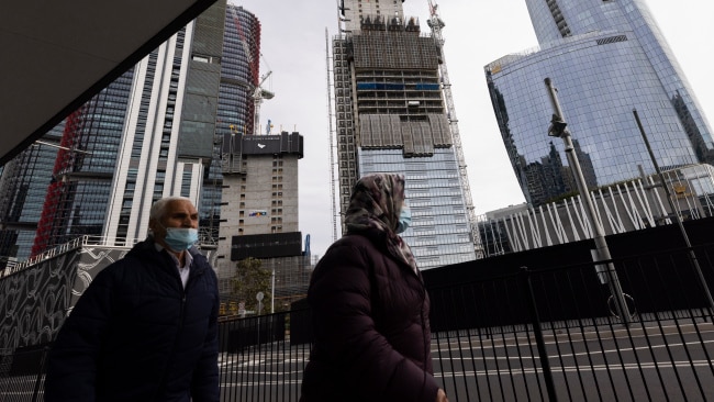 Two people in face masks are seen near Barangaroo in Sydney's CBD on Tuesday during lockdown. Photo: Brook Mitchell/Getty Images