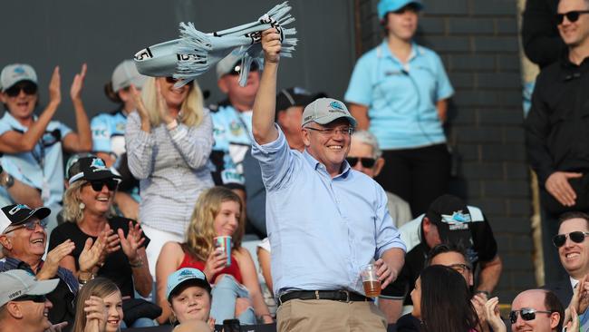 Scott Morrison celebrates at the Cronulla vs Manly match yesterday. The Sharks lost. Picture: Brett Costello