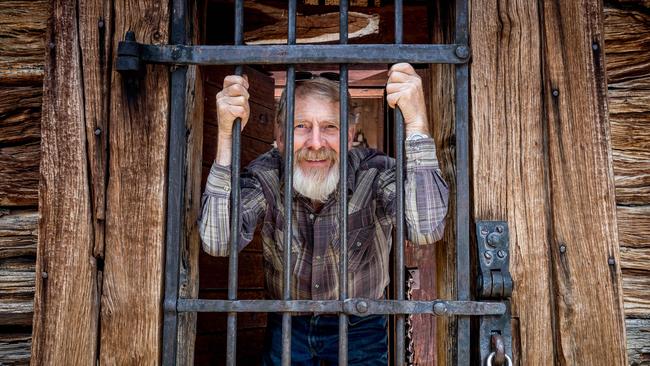 Vice President of the Omeo Historical Society Michael Henry is locked up in the old Omeo jail. Picture: Jake Nowakowski