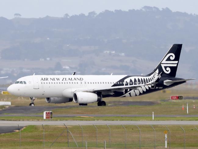 AUCKLAND, NEW ZEALAND - MARCH 16: An Air New Zealand plane is seen at Auckland Airport on March 16, 2020 in Auckland, New Zealand. Air New Zealand has announced it will reduce its international capacity by 85 per cent as a result of the current coronavirus pandemic and its impact on travel demand. The airline is suspending flights between Auckland and Chicago, San Francisco, Houston, Buenos Aires, Vancouver, Tokyo Narita, Honolulu, Denpasar and Taipei from 30 March to 30 June. It is also suspending its LondonLos Angeles service from 20 March through to 30 June. Air New Zealand's Tasman and Pacific Island network capacity will significantly reduce between April and June, while domestic route capacity will be reduced by around 30 percent in April and May. (Photo by Hannah Peters/Getty Images)