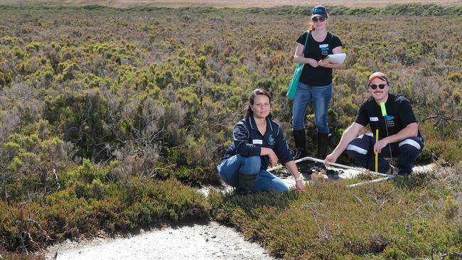 Limeburners Bay near GeelongPort. The Victorian port is working with Deakin University’s Blue Carbon Lab to study how coastal wetlands can mitigate climate change. From left, marine ecologist Maria Palacios from Deakin, and the port’s counsel Jaclyn Masters and environmental specialist Nelson Taylor. Picture: Mark Wilson