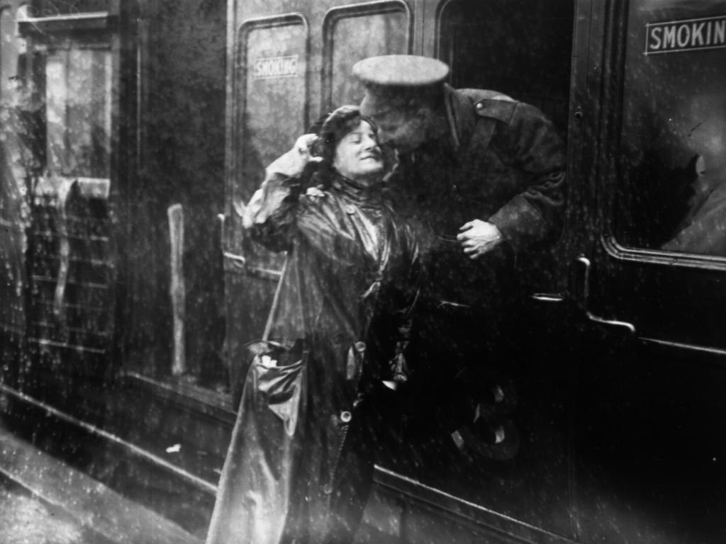 A soldier saying goodbye to a loved one in the rain at Victoria station, London, as he leaves for the front. Picture: Getty