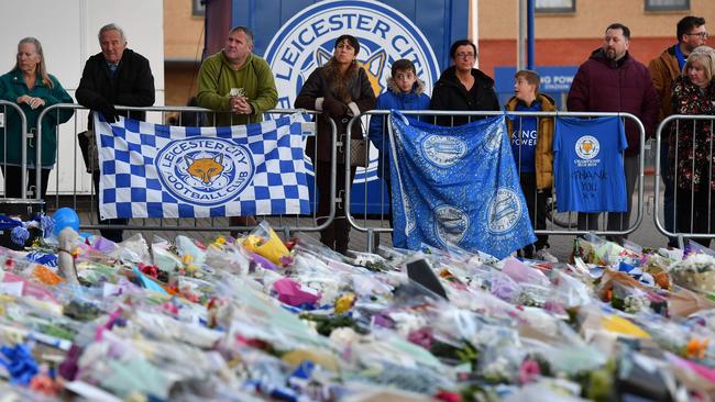 A fan comes to Leicester’s ground to pay her respects to Vichai Srivaddhanaprabha.