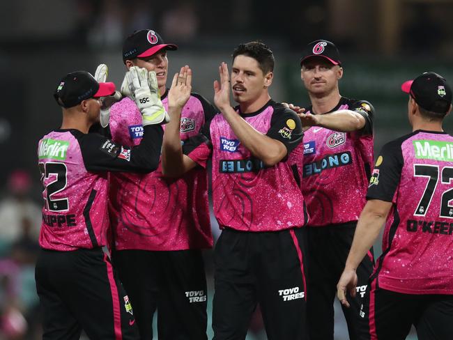 SYDNEY, AUSTRALIA - DECEMBER 08: Ben Dwarshuis of the Sixers celebrates after taking the wicket of Tom Rogers of the Renegades during the BBL match between Sydney Sixers and Melbourne Renegades at Sydney Cricket Ground on December 08, 2023 in Sydney, Australia. (Photo by Jason McCawley - CA/Cricket Australia via Getty Images)
