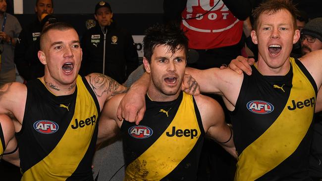 (L-R) Dustin Martin, Trent Cotchin and Jack Riewoldt of the Tigers react after winning the Round 18 AFL match between the Richmond Tigers and the Greater Western Sydney Giants at the MCG in Melbourne, Sunday, July 23, 2017. (AAP Image/Julian Smith) NO ARCHIVING, EDITORIAL USE ONLY