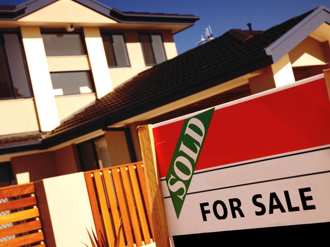 For sale sign with a house in the background. Modern Australian architecture. Room for more text on sign.Also see: