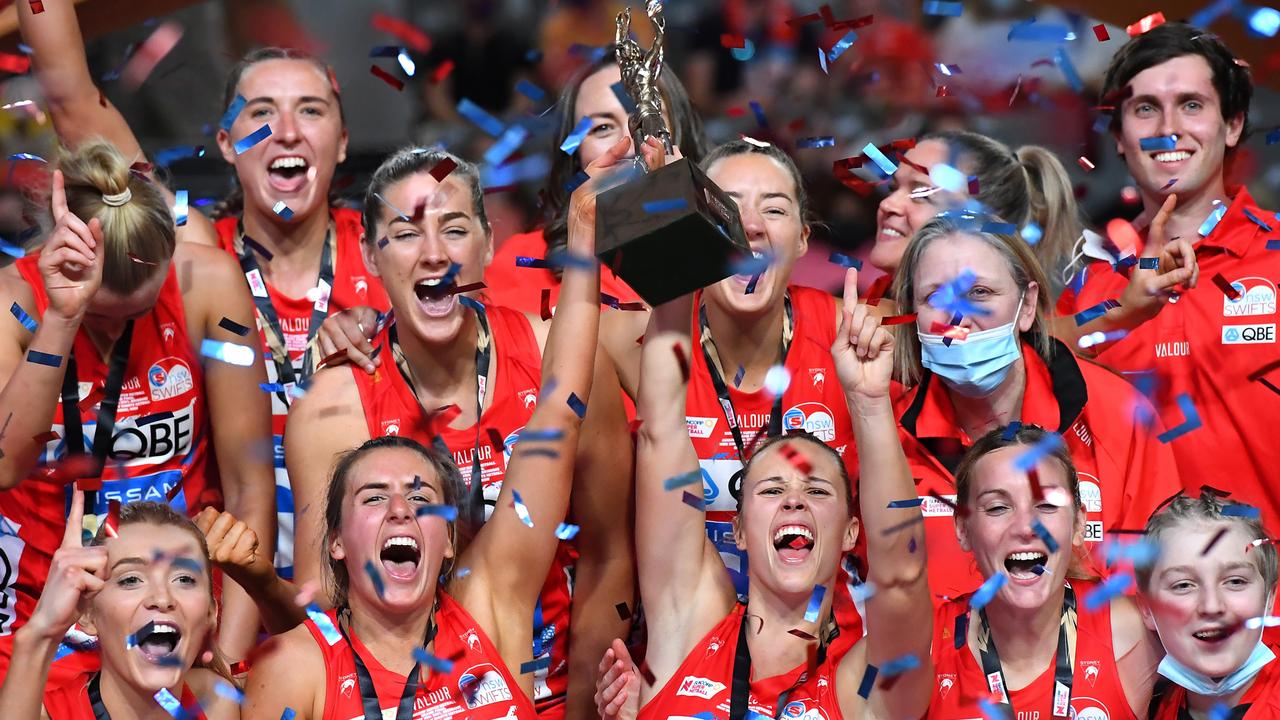 Sophie Garbin (back row, third from left), celebrates her second Super Netball premiership win with the Swifts in Brisbane in August. Photo: Getty Images