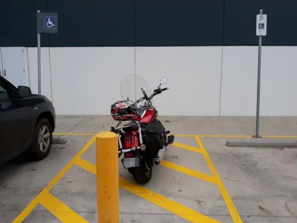 The motorbike had parked on a hatched area next to two car spots reserved for disabled permit holders. Picture: Australian Disability Parking Wall of Shame/Facebook