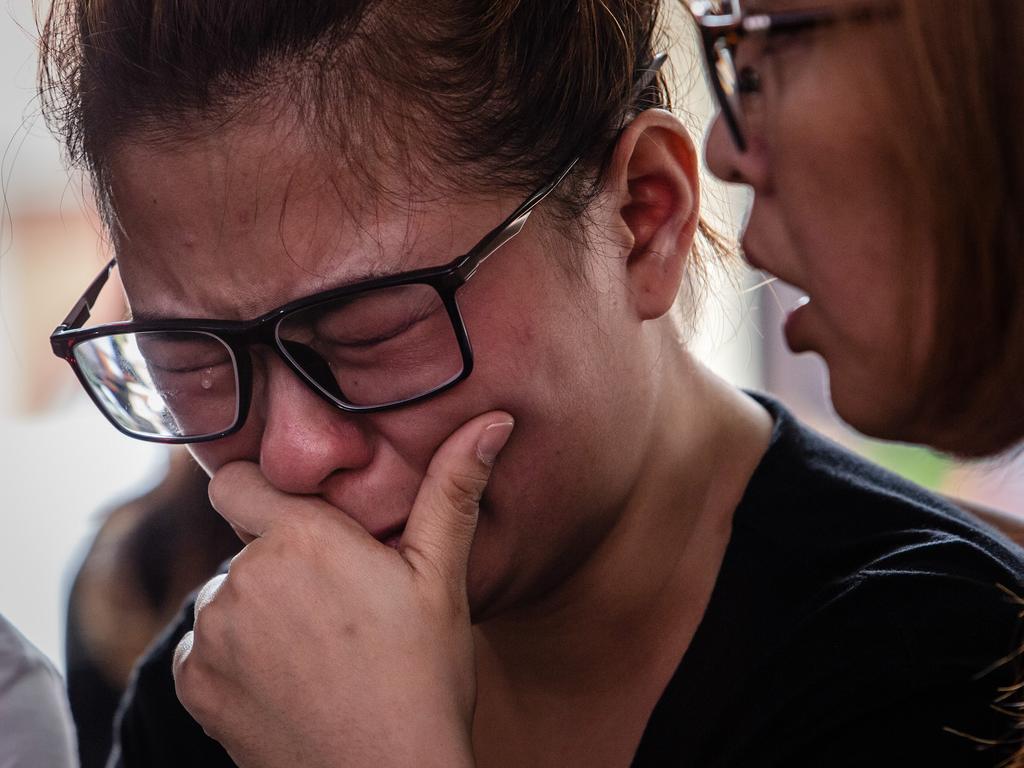 Ningsi Ayorbaba weeps as she await news of her husband Paul Ferdinan Ayorbaba, a victim of Lion Air flight JT610. Picture: Getty