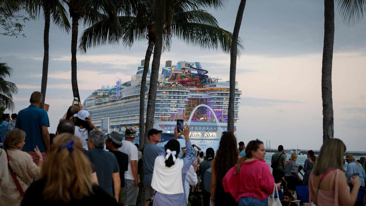 Hundreds of people came to watch the Icon leave port. Picture: Marco Bello/AFP