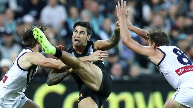 Chad Wingard gets his kick away under (rare) pressure in the Power’s crushing win over Fremantle. Picture: Sarah Reed