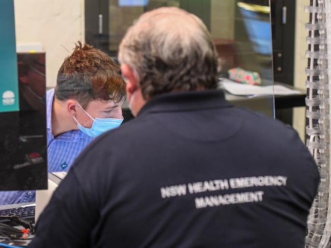 POOL PHOTOS. SMH News, Sydney. Story  - NSW Premier Gladys Berejiklian covid vaccines  announcement at the RPA Hospital. Photo shows,   POOL Photos taken at the RPA Vacination Centre in Mallett Street Camperdown. Photo shows, Emergency/ Medical workers register to have the vaccine shot at the centre.       Photo by Peter Rae Monday 22 February 2021