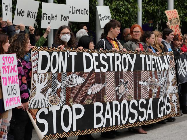 MELBOURNE, AUSTRALIA - NOVEMBER 15: Protesters gather at the front of the Federal Court of Australia on November 15, 2022 in Melbourne, Australia. The Federal Court is hearing an appeal by Santos Ltd., which seeks to restart drilling in the Barossa Gas project, located near the Tiwi Islands off the northern coast of Australia. Courts had earlier ruled the approval for drilling in the project as invalid. (Photo by Tamati Smith/Getty Images)