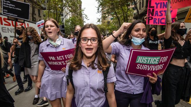 Schoolgirls march in a rally to protest violence against women. Picture: Jason Edwards