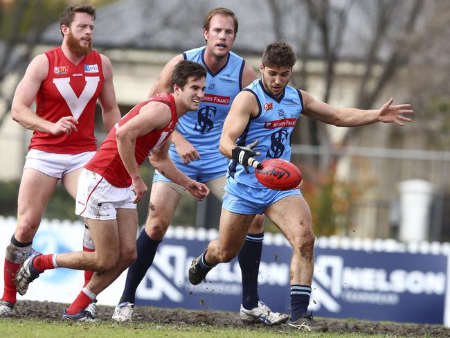 James Battersby gets his kick away for Sturt while sporting a protective glove as he recovered from a snapped finger tendon. Picture: Sarah Reed