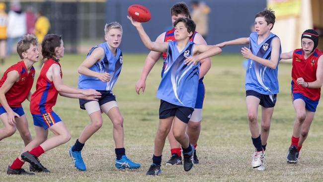 day three of the School Sport SA Sapsasa Country Football Carnival - Year 7 Division 2: Murray Mallee (red) v Southern Fleurieu (blue)  at West Beach , 2 June 2021. Picture Simon Cross