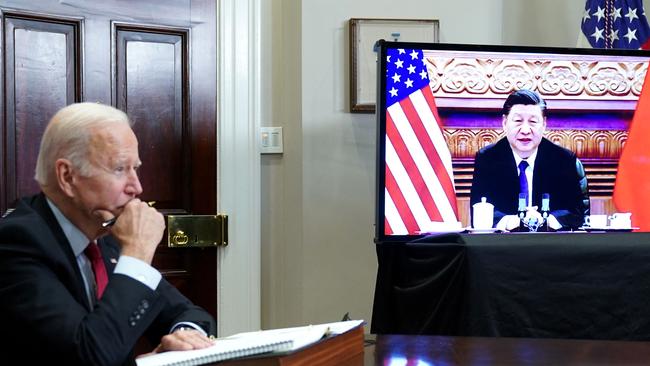 Joe Biden meets with China's President Xi Jinping during a virtual summit from the Roosevelt Room of the White House. Picture: AFP.