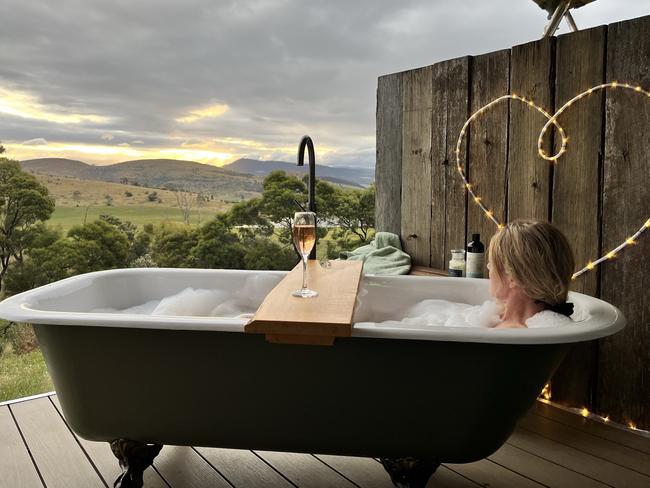 An outdoor bath with a view on the deck of the luxury, off-grid glamping tent at Aquila Glamping at Richmond. Picture: Supplied.