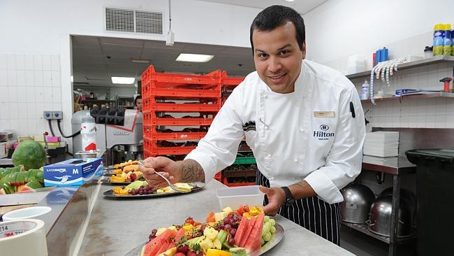 Hilton Executive sous chef Brent Assam puts the final touches on to fruit platters for the TDU teams staying at the Hilton. P...