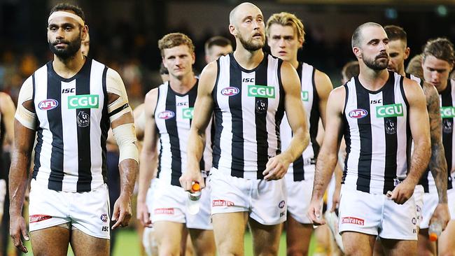 Collingwood players after the loss to Hawthorn.