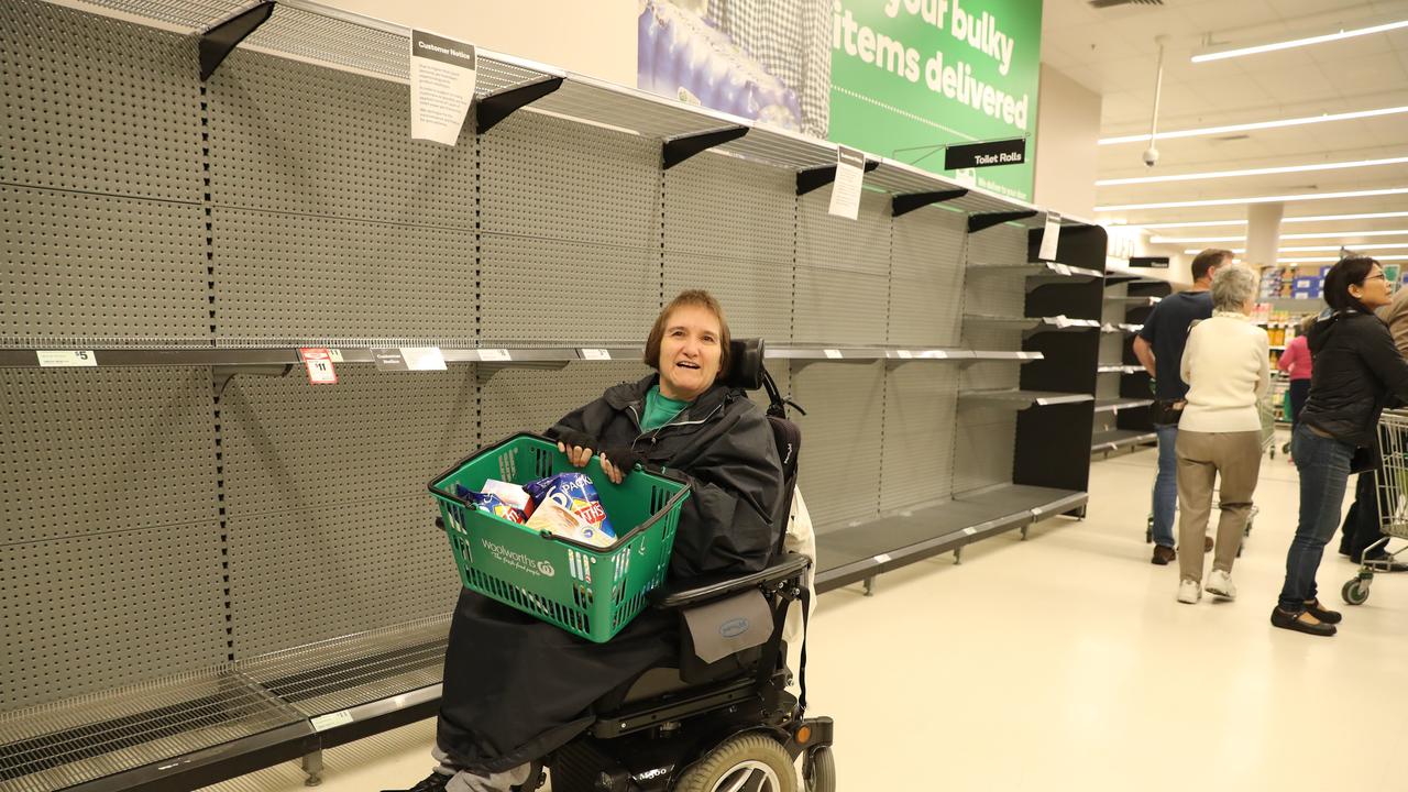 Helen Woodman - toilet paper already sold out before store opened. Early morning shoppers at Woolworths in Crows Nest earlier this month. Picture Rohan Kelly