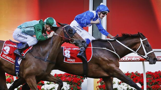 Cox Plate Moonee Valley. Winner of the Cox Plate Winx ridden by jockey Hugh Bowman punches the air at the finish line. Picture: David Caird