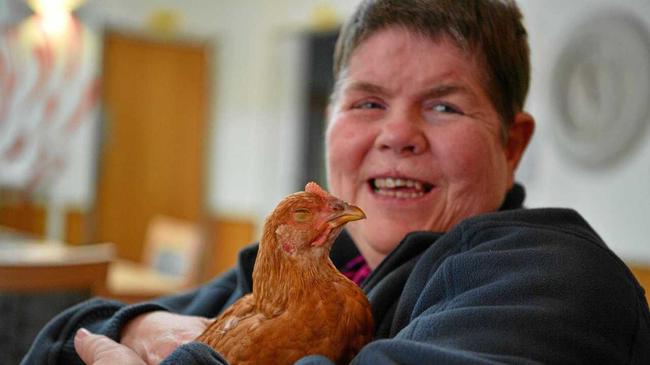 FEATHERED FRIEND: Lutheran Services' Immanuel Gardens resident Clare Connelly hangs out with one of the facility's chickens. Picture: John McCutcheon
