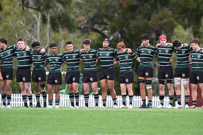 Big Tavita Loughland (fourth from the right with black head strapping) and his BBC teammates brace for impact against Churchie last season.