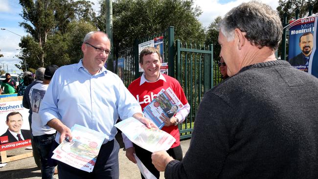 Labor Opposition Leader Luke Foley and Blacktown Mayor Stephen Bali hand out voting papers.