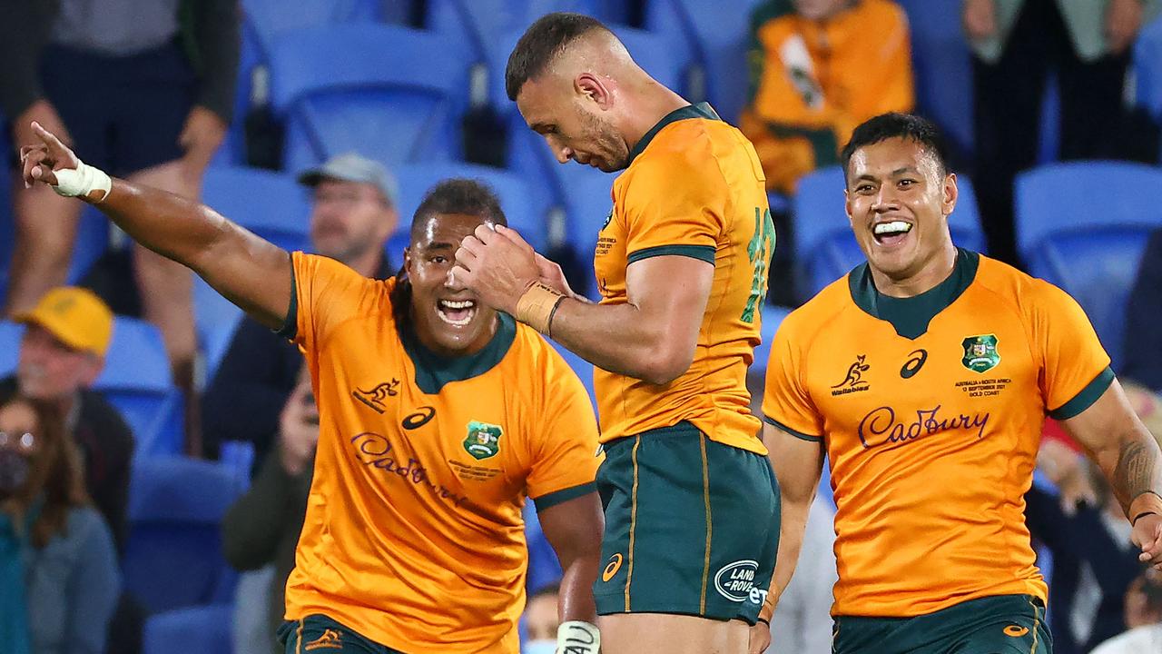 Australian players celebrate Cooper after his winning penalty kick. Picture: Patrick Hamilton / AFP