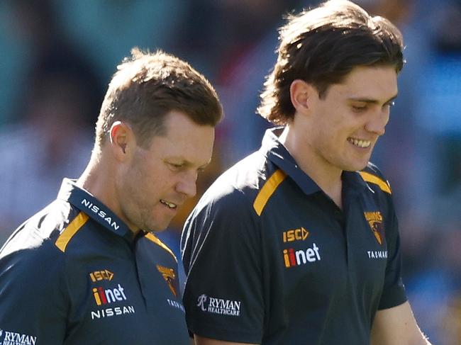 MELBOURNE, AUSTRALIA - MARCH 23: Sam Mitchell, Senior Coach of the Hawks and Will Day of the Hawks look on during the 2024 AFL Round 02 match between the Hawthorn Hawks and the Melbourne Demons at the Melbourne Cricket Ground on March 23, 2024 in Melbourne, Australia. (Photo by Michael Willson/AFL Photos via Getty Images)