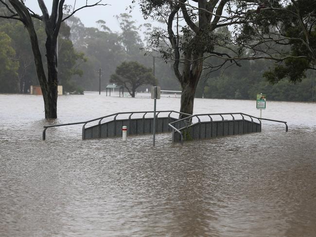 The Georges River running alongside Henry Lawson Dr at Chipping Norton on Sunday. Picture: Gaye Gerard