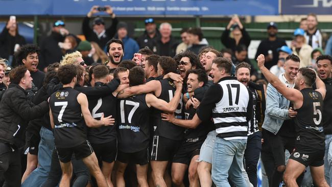 Port District players and fans celebrate their premiership win after the siren. Picture: Tricia Watkinson