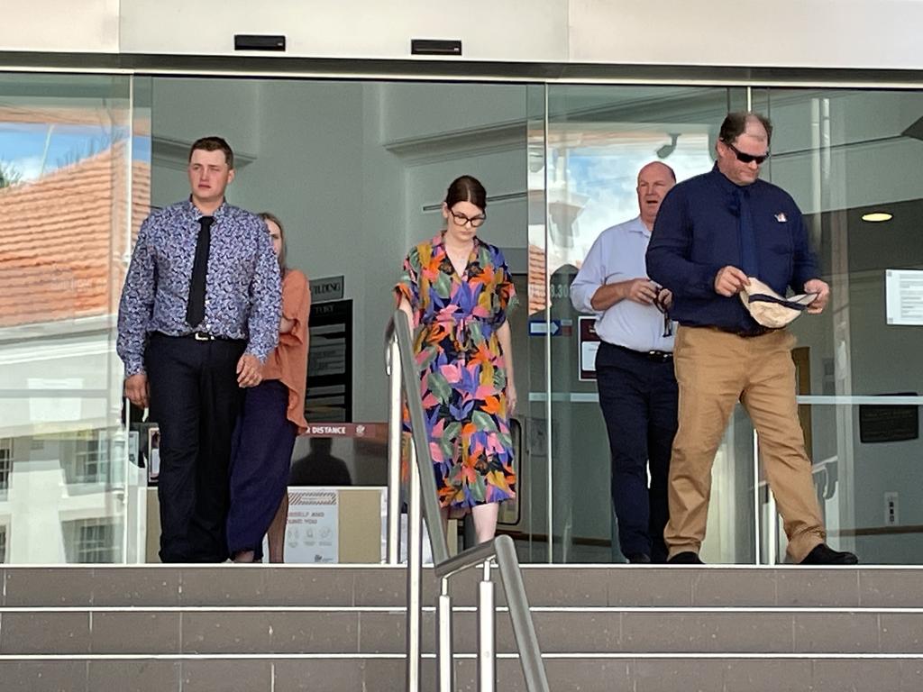 Jak Alan Kuhn (far left with dark tie) and Aaron Frederick Harold Kuhn (on the right in a navy shirt and tan pants) leaving Rockhampton court house during a trial where they have been accused of assault Craig Douglas Chicken with a baseball bat, chain and fists.